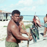 Fishermen on shore. Tuamotus Islands, French Polynesia, January 1976.
