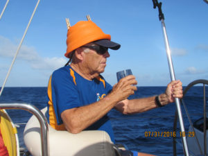 Wearing a bright orange colander adorned with clothes pins as my crown and holding a boat hook as my trident, I was fully prepared to be the official emissary of King Neptune, Ruler of the Sea, for our equator-crossing ceremony. July 31, 2016.