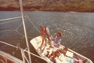 Captain Bob joins me on the whaler as we pose with two of the many fish that we caught during our Firebird journey over 40 years ago. Marquesas Islands, December 1975.