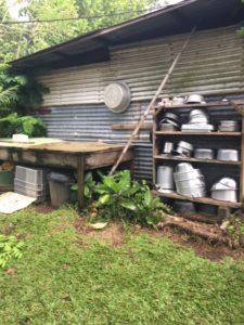 Pots and pans stack neatly on shelves next to Charlie’s and Desiree’s house, ready for use. Despite its primitive look, his farm was clean, organized and very productive. Opoa Valley, Raiatea, Society Islands. October 2016. Photo: S. Rehnborg