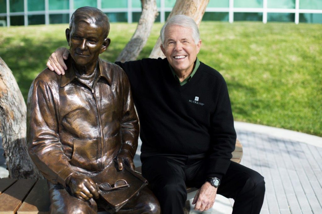 Sitting next to a life-size statue of my father Carl F. Rehnborg, it’s easy to see why it’s a favorite photo stop for visitors at the Nutrilite Health Institute. The statue was inspired by his famous “pepper tree talks" and his many conversations filled with visionary ideas. Buena Park, California. March 2017.