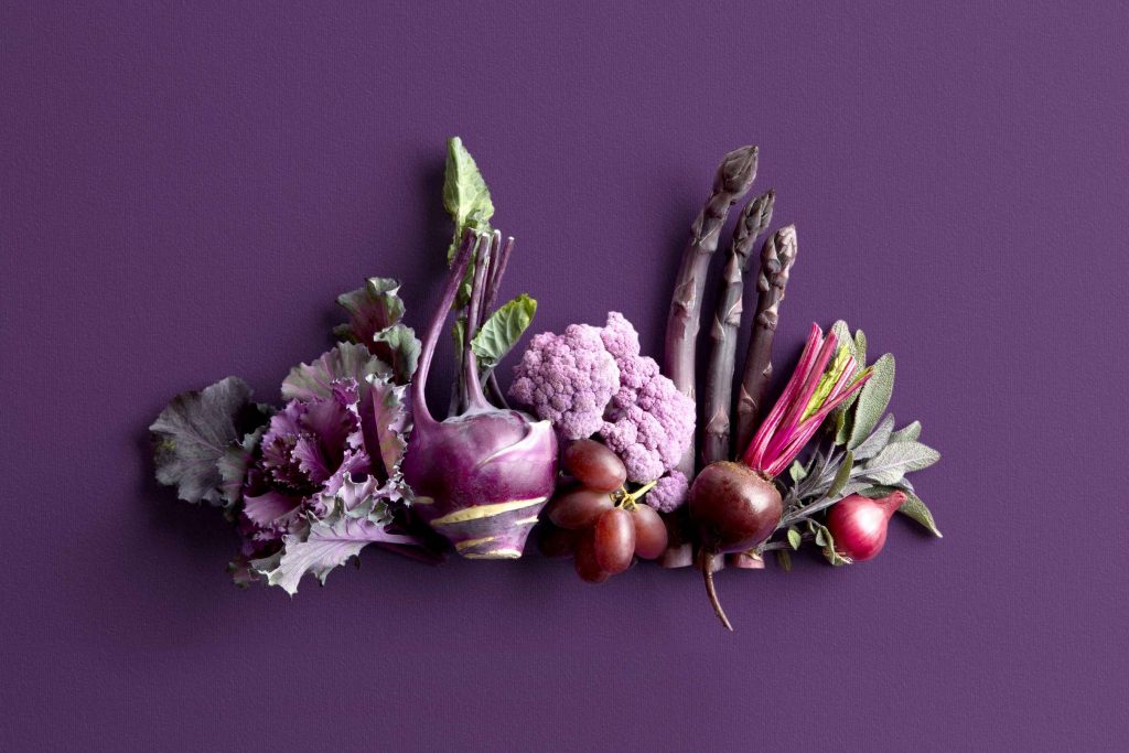 An assortment of purple fruits and vegetables. The wide variety makes it easy to find favorites to include in your meal plans for brain health benefits.