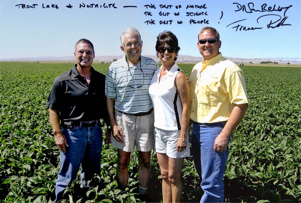Phil (left) and Darwin Hintz (right) join Francesca and me in a growing Echinacea purpurea field. Their modern farming and technology leadership play a key role in many crops destined for Nutrilite™ products. Trout Lake East Farm, Wash, 2019.