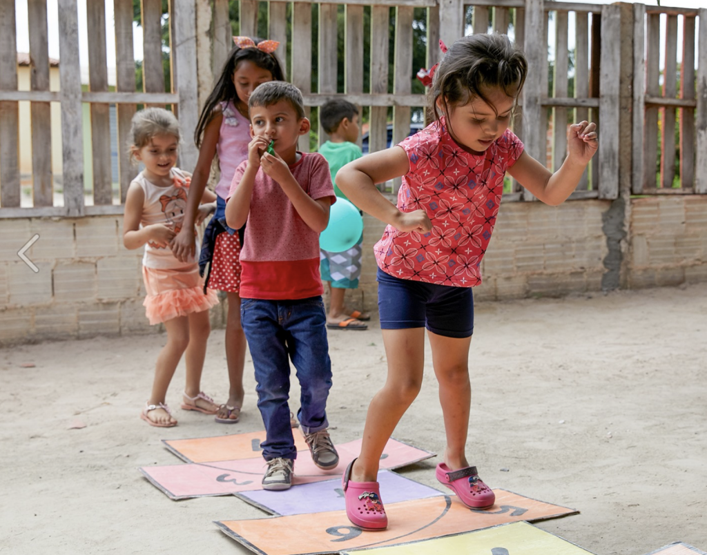 Children playing hopscotch. Play is one of the most effective forms of childhood development. However, to play, kids need energy and adequate nutrition. The Power of 5 Campaign provides children with nutrients they need to help fuel their play.