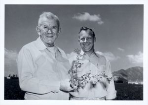 My father Carl Rehnborg holds a sprig of alfalfa. He is accompanied by laboratory technician Dewane Bunting. Lakeview, Calif. 1958.
