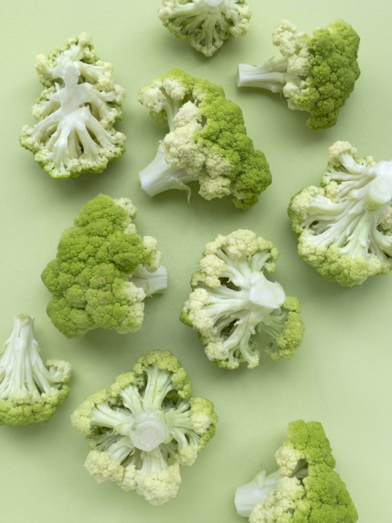 Ten broccoflower florets. If you want a child to eat more vegetables, give them up to 10 different opportunities to taste them, new study shows.