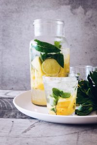 A sparkling glass of water with a sprig of mint and slices of lemon. Fun fact: If you happen to be a big soda drinker, just substituting sparkling water for your daily 12-ounce can of soda can result in over 14 pounds (6.5 kg) of weight loss in one year. Little changes can make BIG differences!