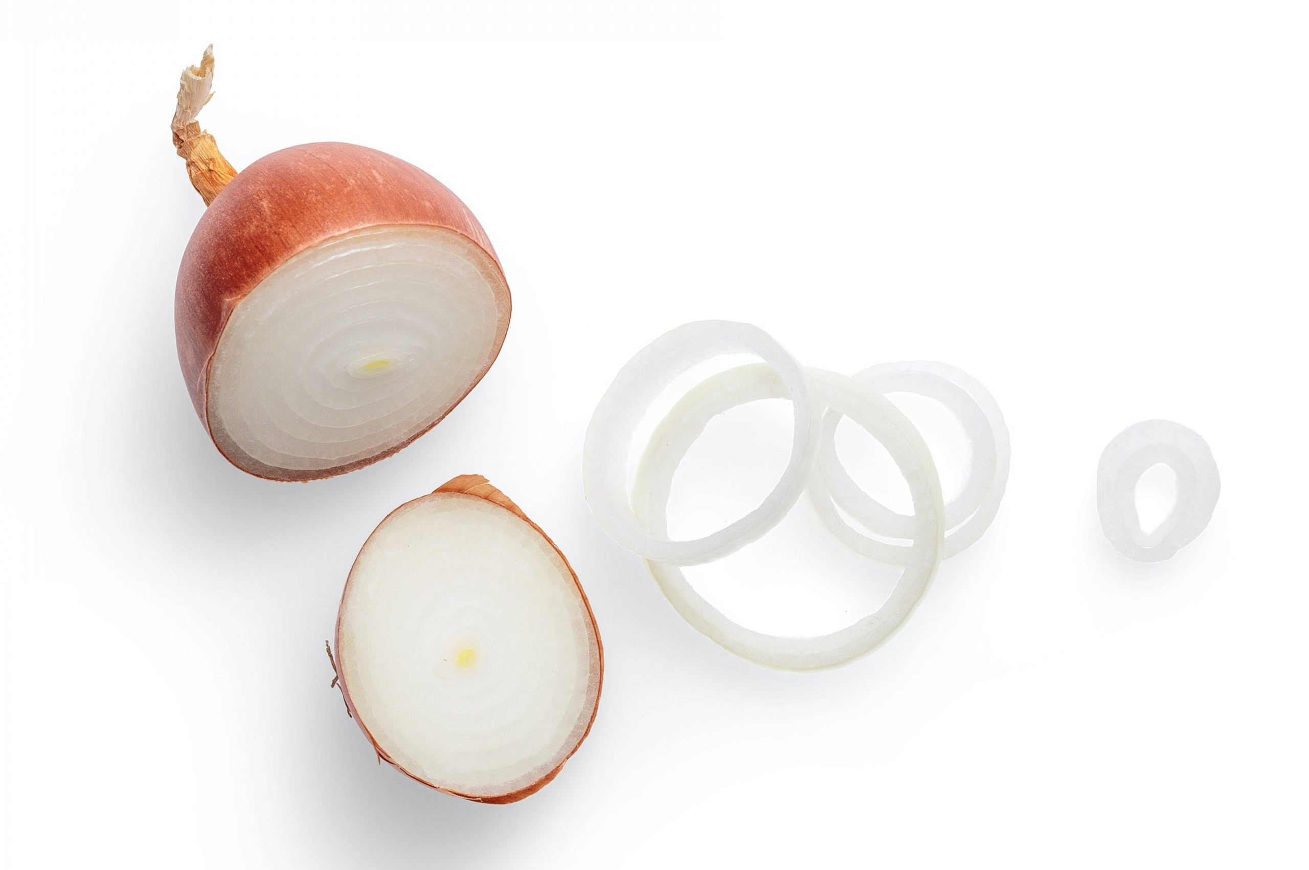 Sliced white onion. The outermost layers are often discarded during food preparation, yet contain the most antioxidants.