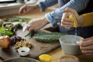 Cooking in the kitchen. A newly released study found that those consuming a plant-based diet also take fewer medications daily.